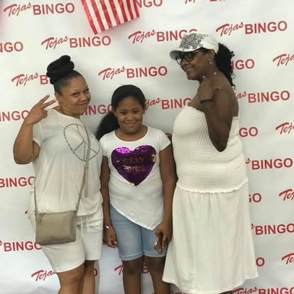 Three women posing at a Tejas Bingo event