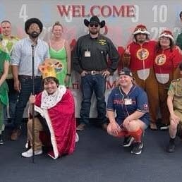Group in costumes at a welcome event